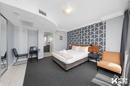 KozyGuru | CBD Queen Bed Studio Cozy & Convenient