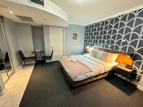 KozyGuru | CBD Queen Bed Studio Cozy & Convenient