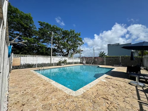Walk to Beach • Pool • Balcony views + BBQ Grill