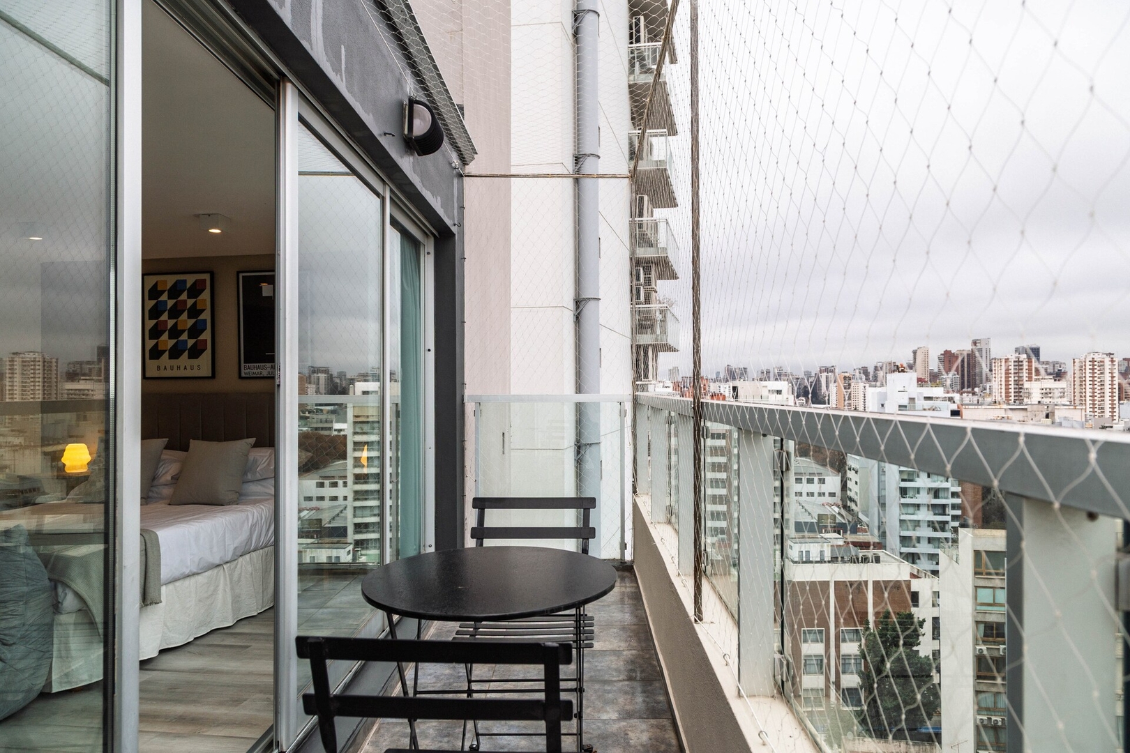 Balcony seating, safety netting and nearby buildings in Buenos Aires