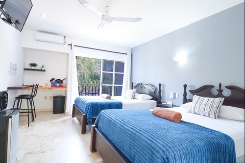 "Spacious Room with Two Double Beds" 9 El Corazon del Caribe