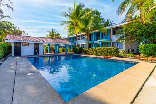 Sun-Kissed 2BR Oasis — A Pool & 5-Min to the Beach