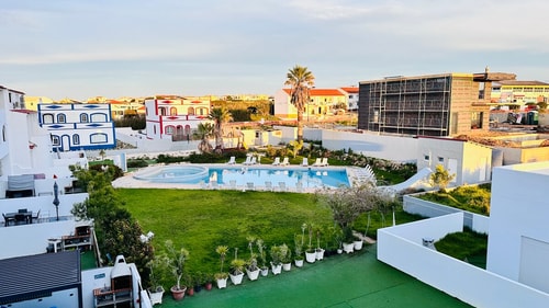 Sagres 1BR | Balcony with BBQ & Pool View