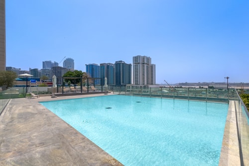 Canal-Front 1BR | Pool, Gym, Free Parking 25 Mi Casa Holiday Homes